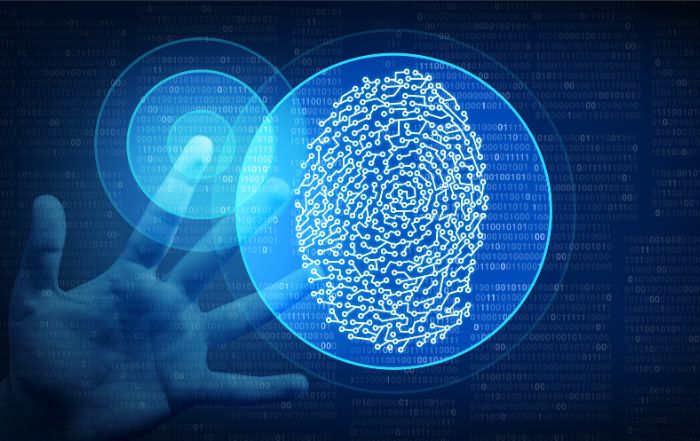 A person’s hand with digitally rendered fingerprint patterns overlaying the fingertips, symbolizing biometric data and privacy technology.