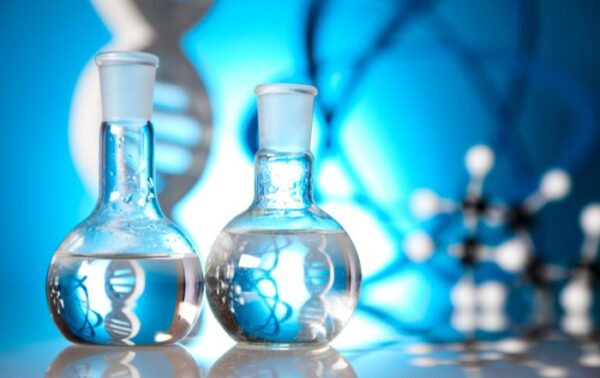 A close-up image of a laboratory beaker containing chemicals, symbolizing PFAS chemical testing and analysis.